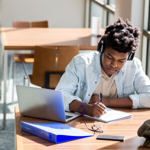 Student taking notes